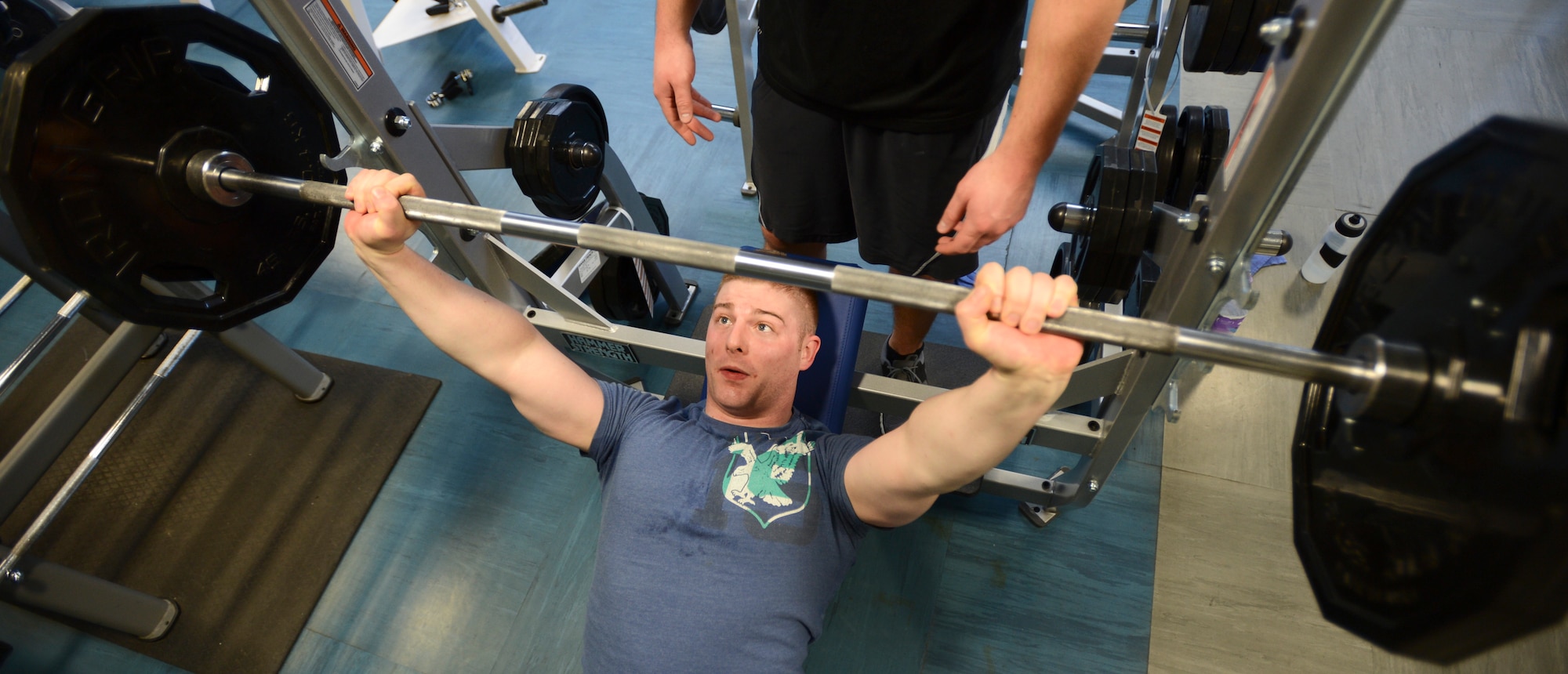 ROYAL AIR FORCE LAKENHEATH, England - Senior Airman Zachary Hill, 95th Reconnaissance Squadron electronic warfare journeyman, RAF Mildenhall, performs an incline bench press on a new piece of equipment at the 48th Fighter Wing Fitness Center Jan. 30, 2012. The center recently assembled and placed new equipment, which is valued at $70,000 and includes items such as bench presses, smith machines, free weight machines and treadmills. Hill is a native of Princeton, Mich. (U.S. Air Force photo by Staff Sgt. Stephen Linch)