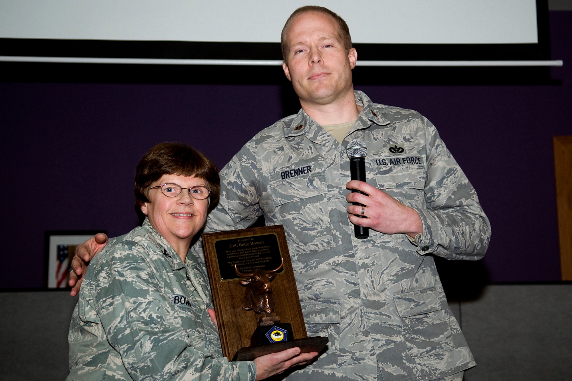 GRISSOM AIR RESERVE BASE, Ind. -- Maj. Paul Brenner, 434th Civil Engineer Squadron commander, presents Col. Betty Bowen, 434th Mission Support Group commander, a plaque in appreciation for her support of CE Jan. 6. Bowen officially retired Jan. 31 after a 32-year military career. (U.S. Air Force photo/Tech. Sgt. Mark R. W. Orders-Woempner)
