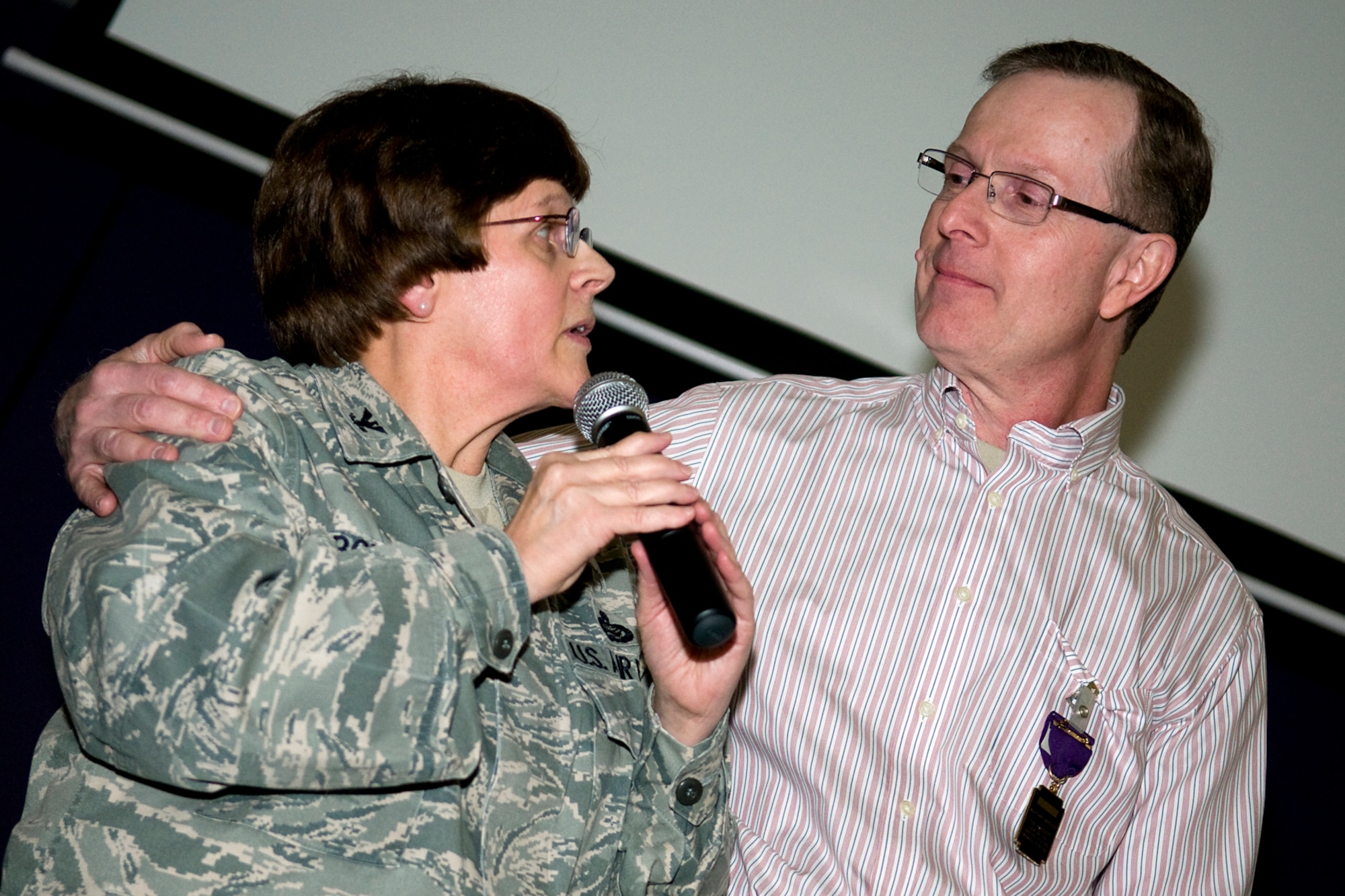 GRISSOM AIR RESERVE BASE, Ind. -- Col. Betty Bowen, 434th Mission Support Group commander, thanks her husband, Bradford, for his support of her 32-year military career during her last commander's call here Jan. 6. According to Bowen, her husband sacrificed his own military career and was never able to retire as he supported her, moving around the country each time she took a new assignment. (U.S. Air Force photo/Tech. Sgt. Mark R. W. Orders-Woempner)
