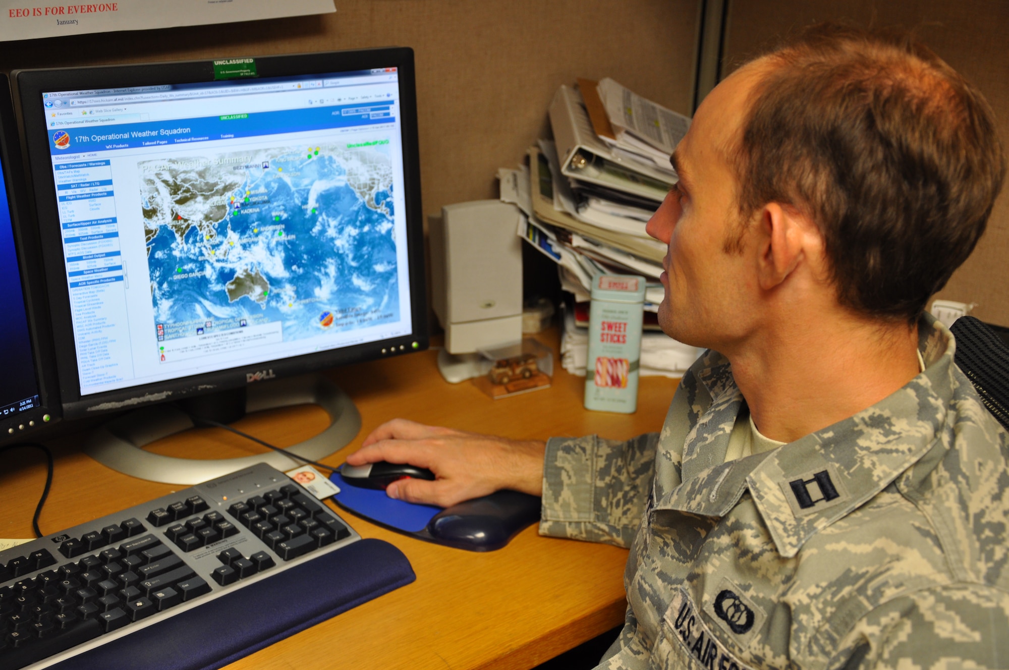 Capt. David Defilippo, weather officer for the 713th Combat Operations Squadron, Detachment 1, at Joint Base Pearl Harbor-Hickam, Hawaii, monitors a weather system over the Pacific Ocean. Defilippo, an Air Force reservist assigned to the 940th Wing, Beale Air Force Base, Calif., provides input to the Pacific Air Force's Forces Staff regarding weather that may impact missions in the PACAF theater. (U.S. Air Force Photo/Dana Lineback)