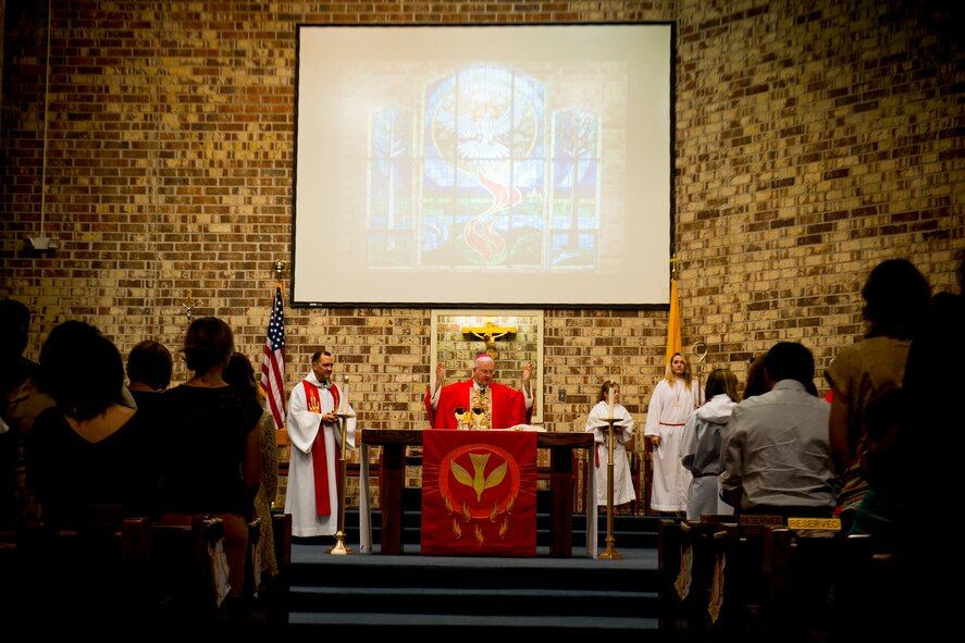 Bishop Richard Higgins, vicar for Veterans Affairs, leads the Liturgy of the Eucharist during Confirmation Mass Jan. 29, 2013, at the Moody Air Force Base, Ga., chapel. Higgins visited Moody to help five members of Team Moody embark on the next stage of their religious journey. (U.S. Air Force photo by Staff Sgt. Jamal D. Sutter/Released)