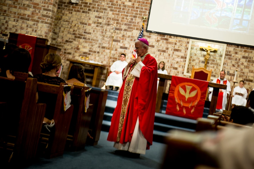 Bishop Richard Higgins, vicar for Veterans Affairs, speaks during Confirmation Mass Jan. 29, 2013, at the Moody Air Force Base, Ga., chapel. Five Team Moody members took part in a Sacrament of Confirmation, an event that took a year’s worth of preparation. (U.S. Air Force photo by Staff Sgt. Jamal D. Sutter/Released) 