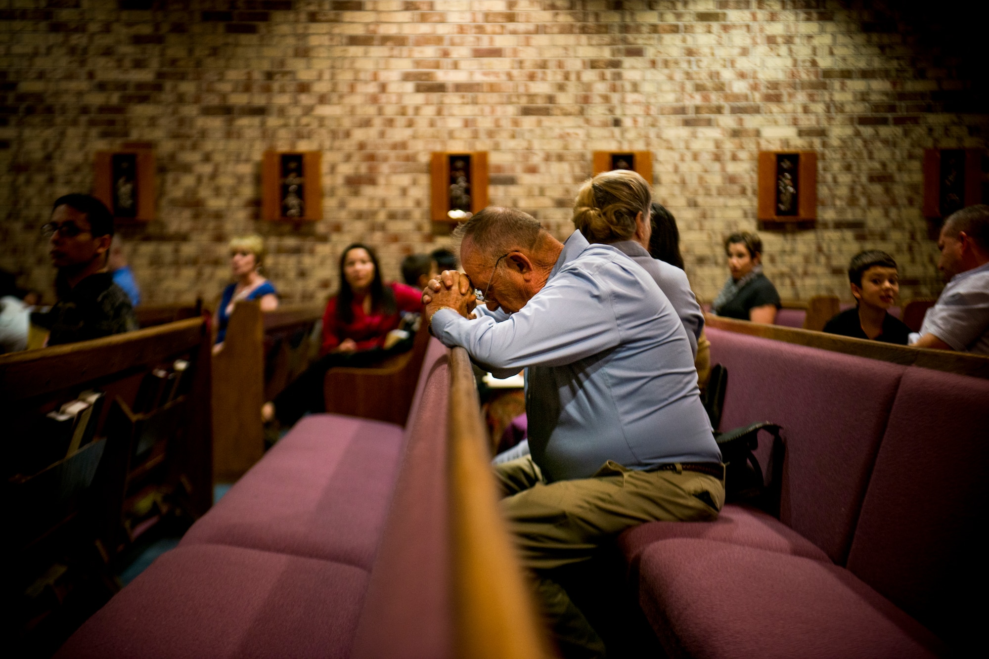 Tom Collins takes a moment to pray before the beginning of Confirmation Mass Jan. 29, 2013, at the Moody Air Force Base, Ga., chapel. The event was led by Bishop Richard Higgins, vicar for Veterans Affairs. (U.S. Air Force photo by Staff Sgt. Jamal D. Sutter/Released) 
