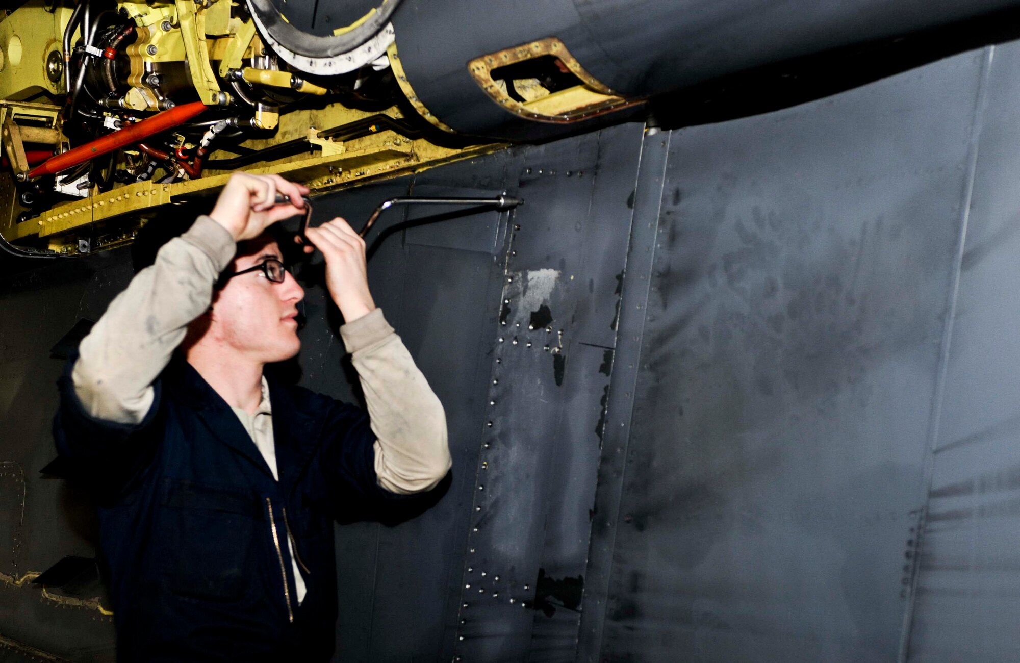 Airman 1st Class Joshua Gomez, 28th Maintenance Squadron aerospace maintenance technician, removes panels off a B-1 during an isochronal inspection at Ellsworth Air Force Base, S.D., Jan. 23, 2013. During an isochronal inspection, every inch of the B-1 is looked at and inspected for anything that is out of the ordinary that could prevent the aircraft from performing its mission . (U.S. Air Force photo by Airman 1st Class Anania Tekurio/Released) 