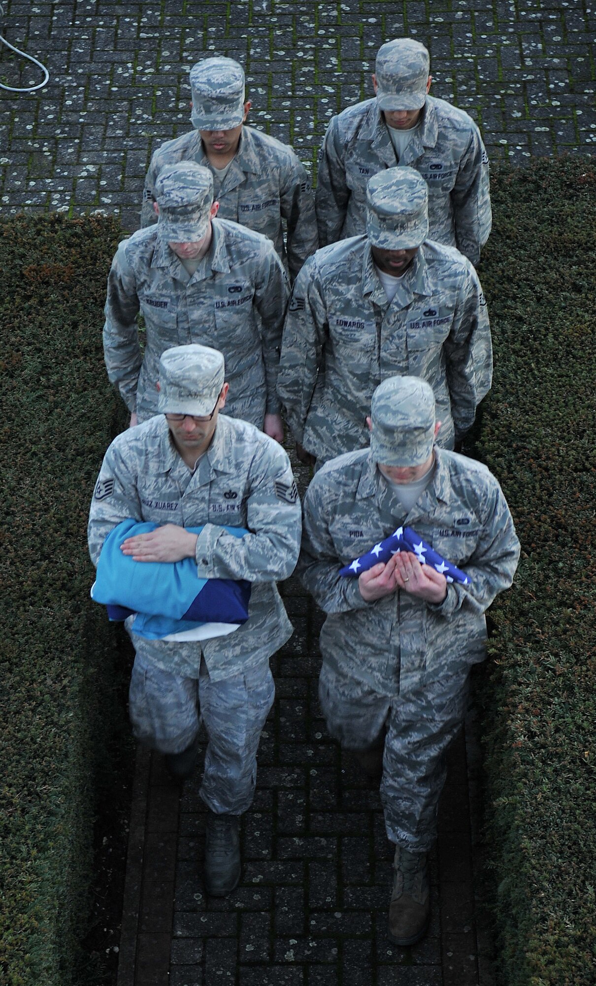 Team Mildenhall honor guardsmen march during a retreat ceremony Jan. 30, 2013, at RAF Mildenhall, England. The ceremony was held in honor of Chief Master Sgt. Christopher Powell, 100th Air Refueling Wing command chief, as he prepares to retire from active duty. (U.S. Air Force photo by Senior Airman Jerilyn Quintanilla/Released)