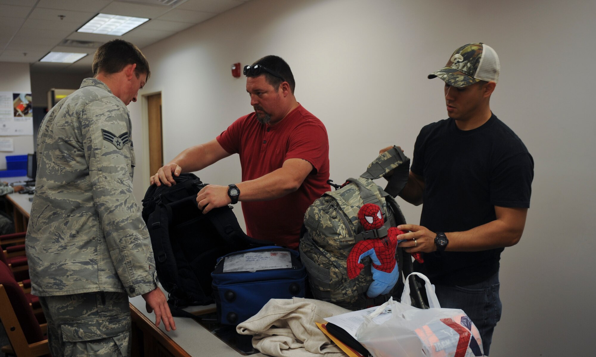 U.S. Air Force Senior Airman Timothy Barnwell, 23d Logisitics Readiness Squadron air transportation, checks bags for prohibited items at Moody Air Force Base, Ga., Jan. 29, 2013. Members of the 23d Maintenance Group, 347th Rescue Group and 23d Logistics Readiness Squadron deployed to Europe for six months. (U.S. Air Force photo by Airman 1st Class Olivia Bumpers/Released)  