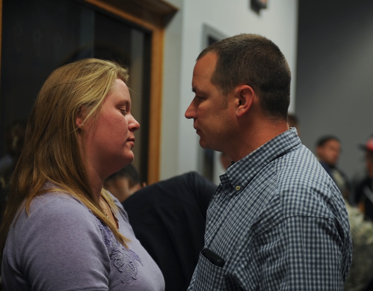 U.S. Air Force Senior Master Sgt. Paul Crumpton, 41st Helicopter Maintenance Unit superintendent, says goodbye to his wife, Gwen, at Moody Air Force Base, Ga., Jan. 29, 2013. Family members, friends and coworkers came out to see their Airmen before they deployed to Europe. (U.S. Air Force photo by Airman 1st Class Olivia Bumpers/Released)