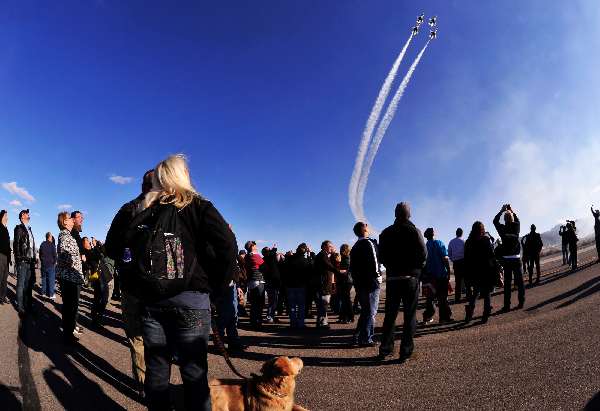 CREECH AIR FORCE BASE, Nev. – Wounded warriors from across the country watch the U.S. Air Force Thunderbirds during a demonstration Jan. 28 on the Creech AFB flightline. The wounded warriors came to Creech as part of a tour of the Las Vegas area. (432d Wing/432d Air Expeditionary Wing/RELEASED)

