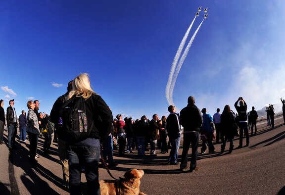 Wounded warriors from across the country watch the U.S. Air Force Thunderbirds during a demonstration Jan. 28 on the Creech AFB flightline. The wounded warriors came to Creech as part of a tour of the Las Vegas area. (432d Wing/432d Air Expeditionary Wing/Released) 

