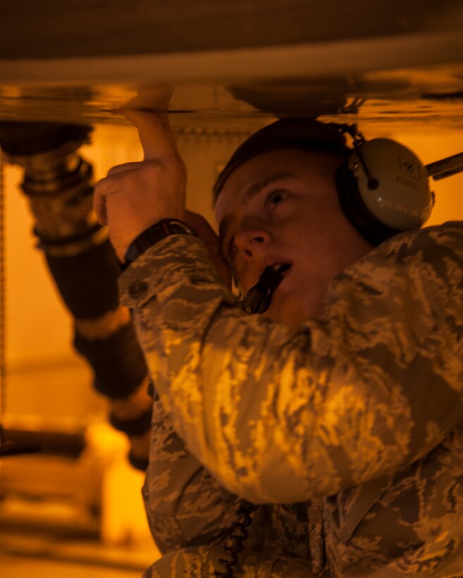 2nd Lt. Logan Dibiasio, 47th Student Squadron, adjusts a component on a T-38 talon in the Hush House in preparation for an engine run up to dry the engines after a cleaning at Laughlin Air Force Base, Texas, Jan. 22, 2013. The 11 T-38 engine mechanics keep 66 T-38 Talons operational to support Laughlin’s mission of producing the world’s best pilots. (U.S. Air Force photo/2nd Lt. David Tart)