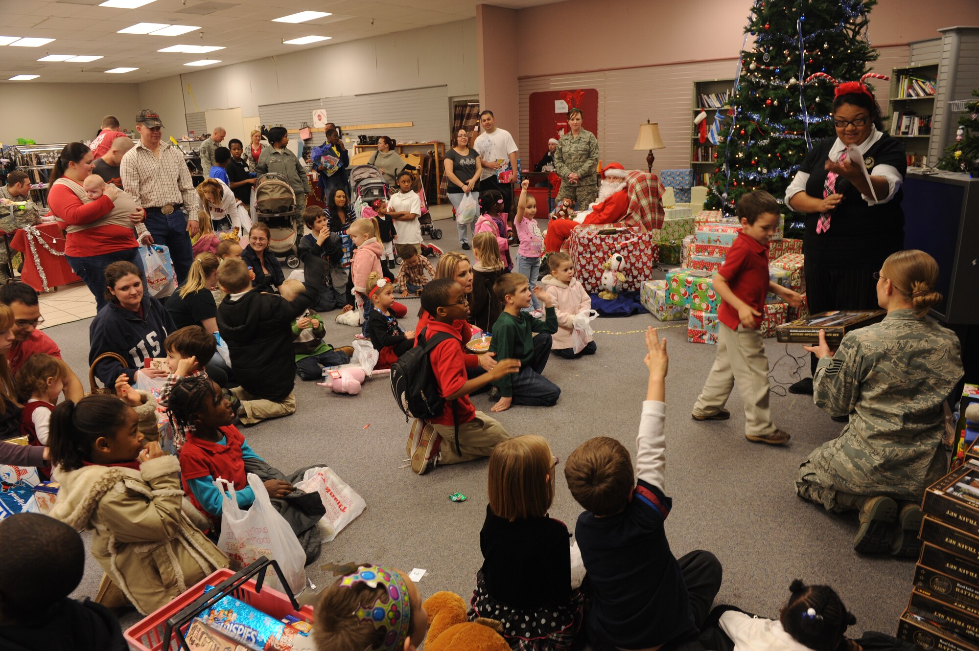 A child receives a gift at the Airman's Attic kid's Christmas party in December, 2012, at Little Rock Air Force Base, Ark. The Airman's Attic provides numerous services to Airmen and their families on base. (U.S. Air Force photo by Airman 1st Class Ethan Dunagan)
