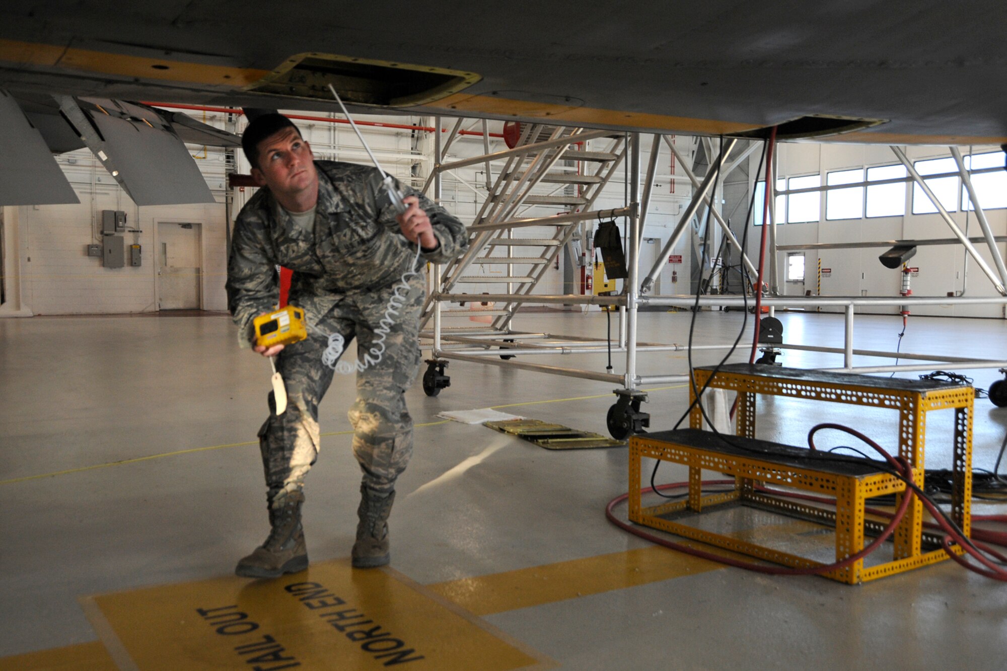 Senior Airman Jake Tufts, 191st Maintenance Squadron, performs an air test during work on a KC-135 Stratotanker at Selfridge Air National Guard Base, Mich., Jan. 16, 2013. The test reports on the presence of jet fuel vapor in the air, a critical safety consideration during indoor maintenance work. The KC-135, assigned to the 127th Air Refueling Group of the Michigan Air National Guard, was being prepared to serve as a platform for testing a prototype of a new aircraft defense system. (Air National Guard photo by John S. Swanson)