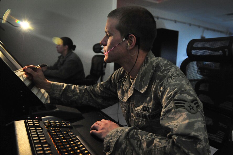 U.S. Air Force Senior Airman Dennis Beasley, 27th Special Operations Support Squadron Air Traffic Controller, runs through simulations in the Radar Approach Control at Cannon Air Force Base, N.M., Nov. 28, 2012. The Air Commando spoke about how a near-death experience served as a wake-up call and turning point in realizing how to cope with life's challenges and the significance of having a strong support system. (U.S. Air Force photo/Senior Airman Alexxis Pons Abascal)  