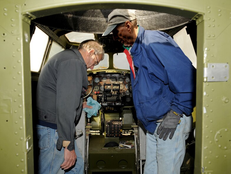 John Henry, left, and Wayne Hyden, Barksdale Global Power Museum volunteers, look for water damage inside a B-17G Flying Fortress on Barksdale Air Force Base, La., Jan. 30. The Barksdale Global Power Museum has an airpark which displays static aircraft and indoor exhibits. The airpark has various restored aircraft from World War II to the present. (U.S. Air Force photo/Airman 1st Class Benjamin Gonsier)