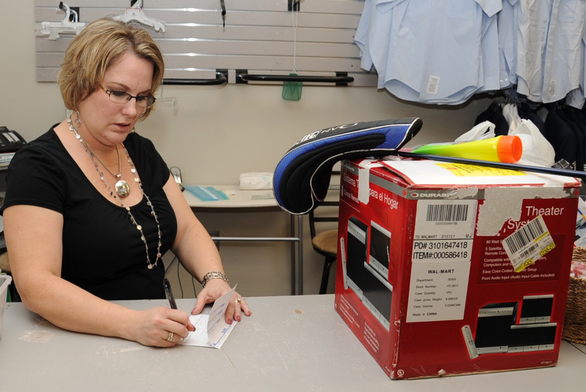 Stefanie Markin, Barksdale Air Force Base?s Military Spouse of the Year recipient, records items for a customer at the Airman?s Attic on Barksdale Air Force Base, La., Jan. 28. Markin is a big asset to the Barksdale community having volunteered more than 1,000 hours to meet the needs of Team Barksdale. (U.S. Air Force photo/Senior Airman Sean Martin)