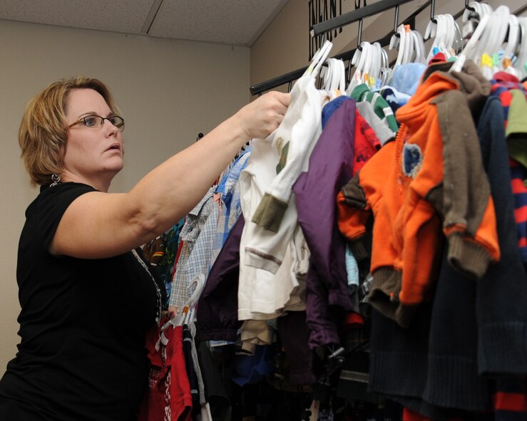 Stefanie Markin, Barksdale?s Military Spouse of the Year recipient, organizes clothes at the Airman?s Attic on Barksdale Air Force Base, La., Jan. 28. Markin has volunteered more than 1,580 hours this year to meeting the needs of Barksdale Airmen as the manager of the Airman?s Attic. (U.S. Air Force photo/Senior Airman Sean Martin)