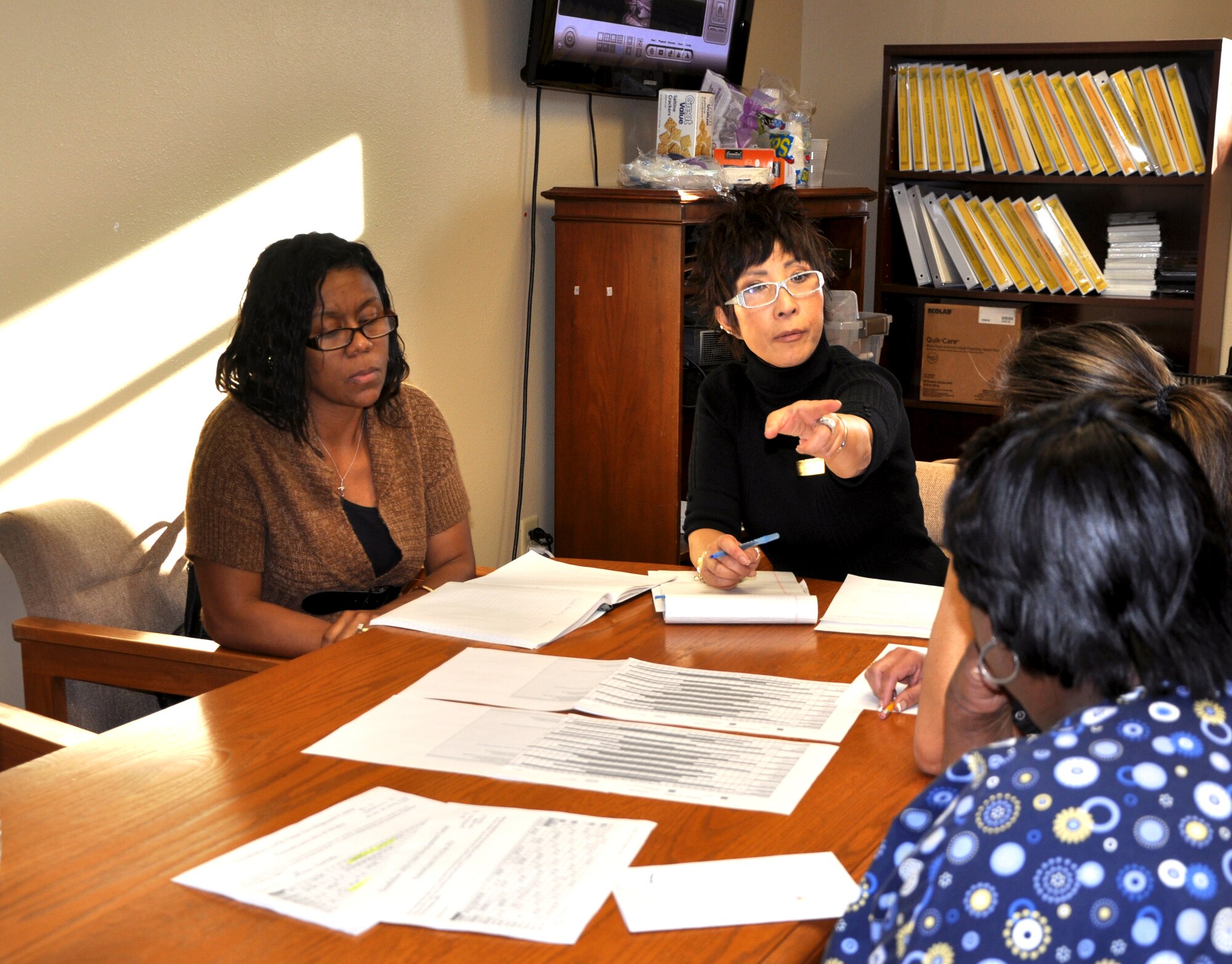 GOODFELLOW AIR FORCE BASE, Texas--  Joon Auci, Child Development Center director, conducts a staff meeting Jan. 30 at the CDC. Auci arrived on base Jan. 2 and plans to focus on customer service. (U.S. Air Force photo/Airman Jessica Keith)