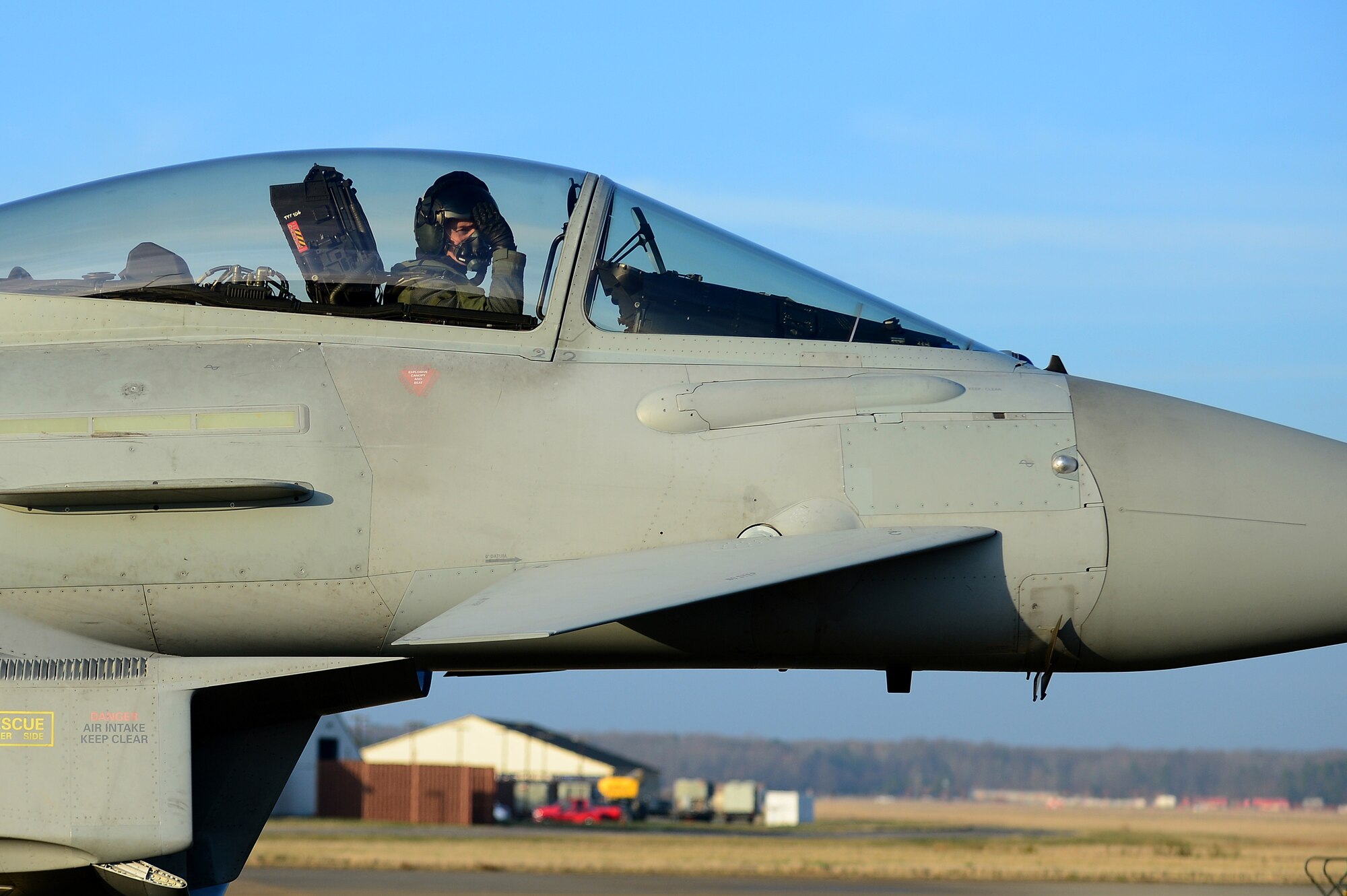 Royal Air Force Wing Cmdr. Paul Godfrey, XI Squadron Typhoon FGR4 pilot, taxis down the flight line during Exercise Western Zephyr at Langley Air Force Base, Va., Jan. 29, 2013.  The XI Squadron is traveling from RAF Coningsby to participate in Coalition exercises.  (U.S. Air Force photo by Senior Airman Kayla Newman/Released) 