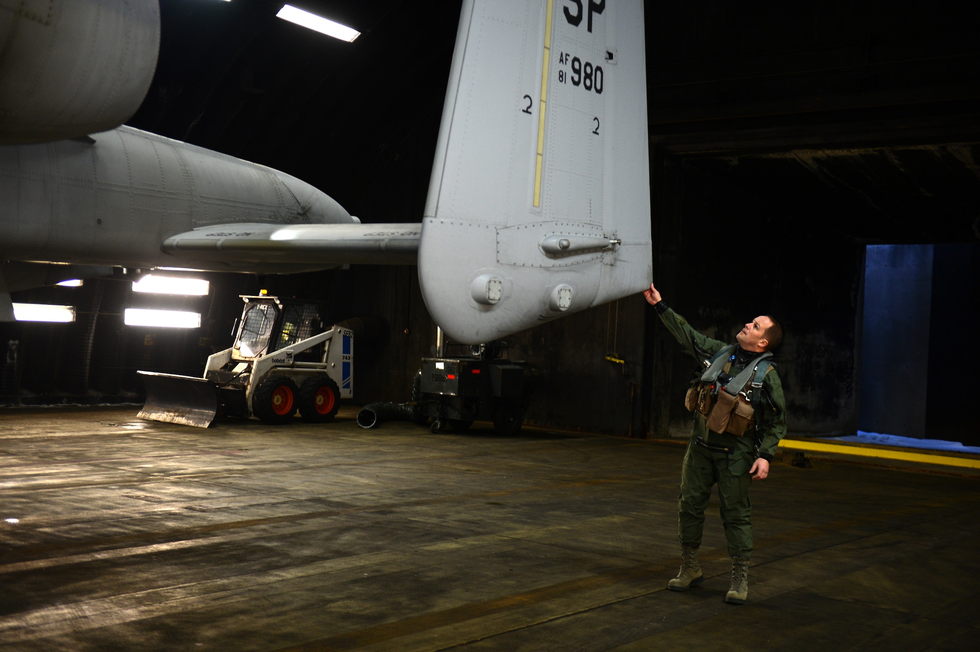 U.S. Air Force Lt. Col. Jeff Hogan, 81st Fighter Squadron director of operations from Olympia, Wash., performs a pre-flight inspection on an A-10 Thunderbolt II on the flightline Jan. 24, 2013. The aircraft is headed to Moody Air Force Base as a result of the 81st Fighter Squadron inactivation. (U.S. Air Force photo by Airman 1st Class Gustavo Castillo/Released)