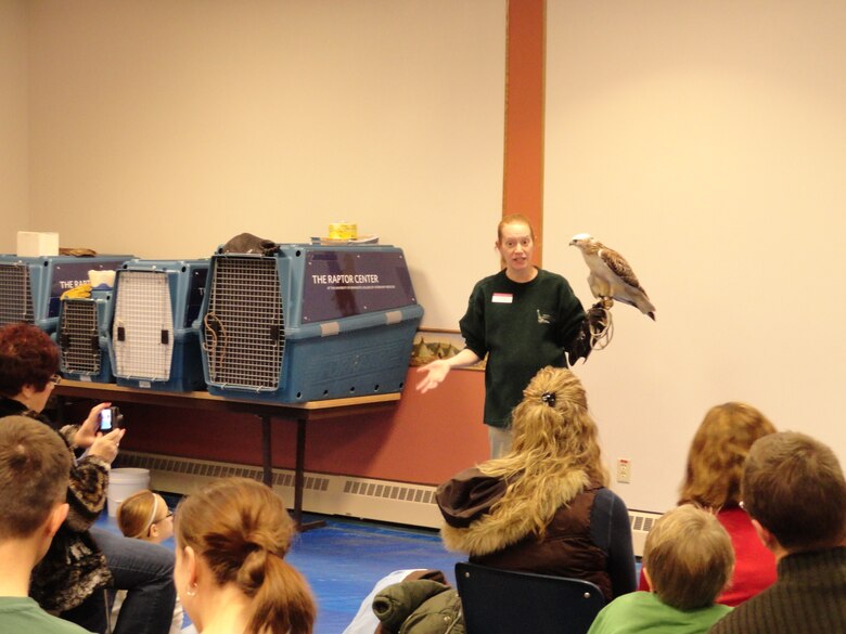 Raptor Center employee Laura Freeman talking about a Krider's red-tailed hawk at Gavins Point Bald Eagle Days program.