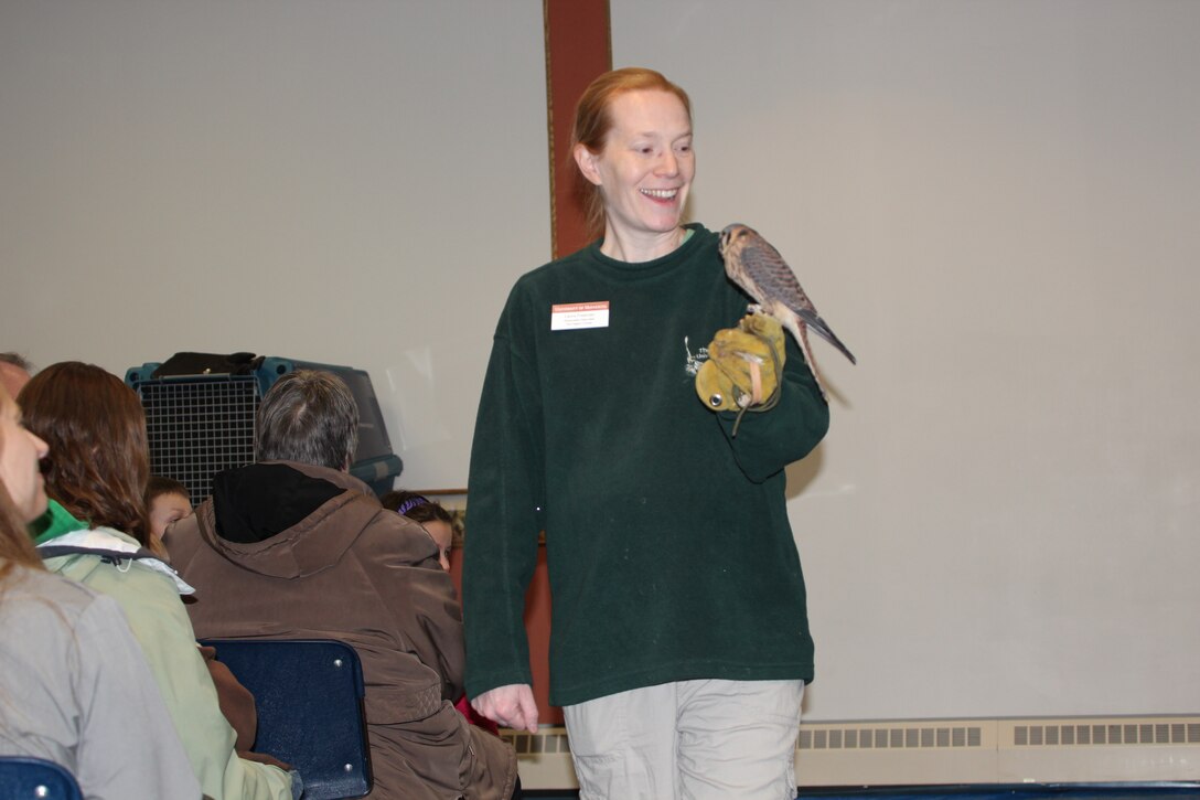 Raptor Center employee Laura Freeman talking about an American kestrel with a group at Gavins Point's Bald Eagle Days