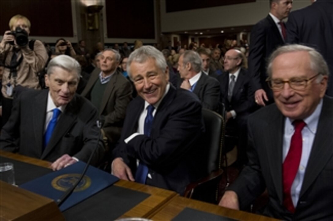 Former Sen. Chuck Hagel, center, is flanked by former Sen. John Warner, left, and former Sen. Sam Nunn, right, prior to his confirmation hearing in the Senate Armed Service Committee at the Dirksen Senate Building in Washington, D.C., on Jan. 31, 2013. Hagel is President Barack Obama’s nominee for Secretary of Defense.  Hagel, if confirmed, will become the 24th Secretary of Defense succeeding Leon E. Panetta. 