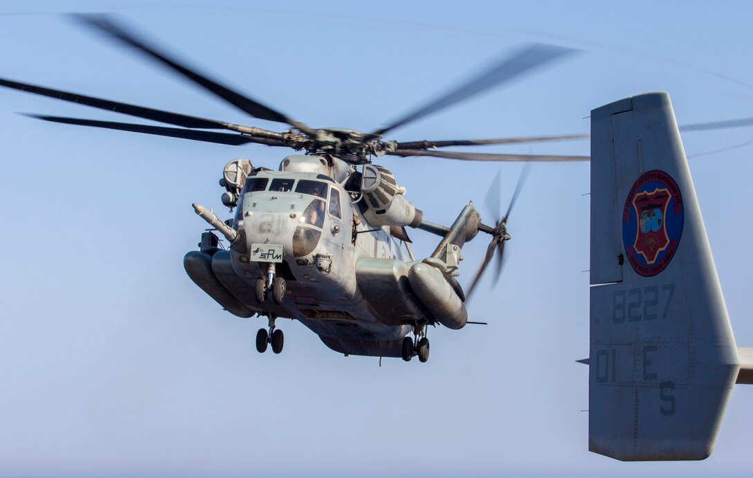 A CH-53 Super Stallion assigned to Marine Medium Tiltorotor Squadron (VMM) 266 (Reinforced), 26th Marine Expeditionary Unit (MEU), lands to transport U.S. Marines assigned to Battalion Landing Team 3/2, 26th MEU, to conduct fast rope familiarization training on the flight deck of the USS Kearsarge (LHD 3), at sea, June 30, 2013. The 26th MEU is a Marine Air-Ground Task Force forward-deployed to the U.S. 5th Fleet area of responsibility aboard the Kearsarge Amphibious Ready Group serving as a sea-based, expeditionary crisis response force capable of conducting amphibious operations across the full range of military operations. (U.S. Marine Corps photograph by Sgt. Christopher Q. Stone, 26th MEU Combat Camera/Released)