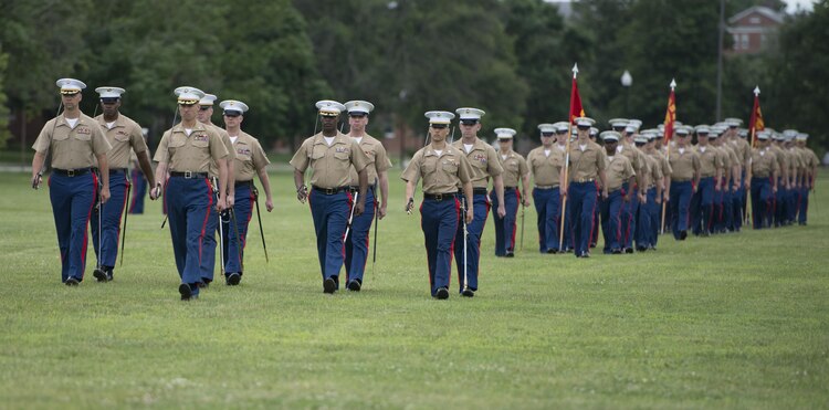 The Marine Cryptologic Support Battlion march are McLaughlin Field to preform a pass and review during their change of command ceremony, June 19. Photo by Pfc. Dylan M. Bowyer.