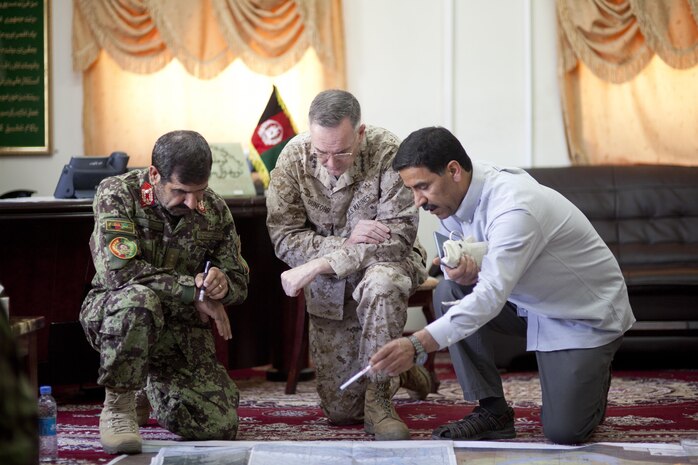 Afghan National Army (ANA) Maj. Gen. Sayed Malook, left, commanding general of the 215th Corps, and U.S. Marine Corps Gen. Joseph F. Dunford, center, commanding general of the International Security Assistance Force, view a map during a visit to Camp Shorabak, Helmand province, Afghanistan, May 27, 2013. Dunford and other ISAF staff toured Camp Shorabak and met ANA leadership and soldiers. (U.S. Marine Corps Photo by Sgt. Tammy K. Hineline)

