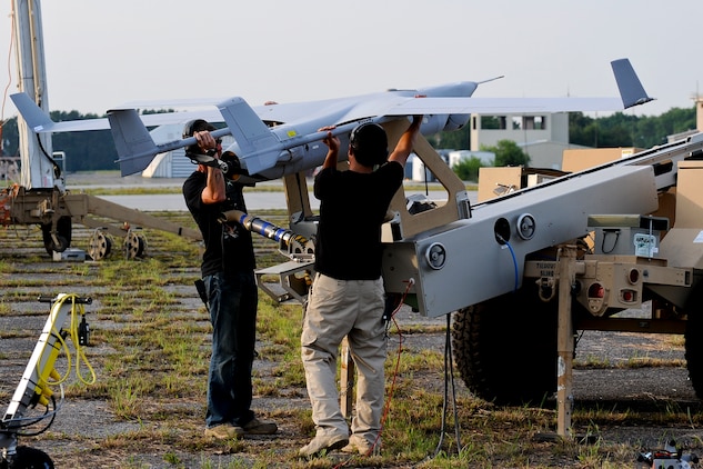 Operators from Insitu Inc. prepare to launch the Navy and Marine Corps RQ-21A Small Tactical Unmanned Air System (STUAS) from Webster Field Annex, June 12. During the flight, operators launched the unmanned aircraft using a pneumatic launcher, eliminating the need for a runway. The RQ-21A was recovered after a 1.8-hour flight, using a company-built system known as the STUAS Recovery System (SRS).(U.S. Navy photo)