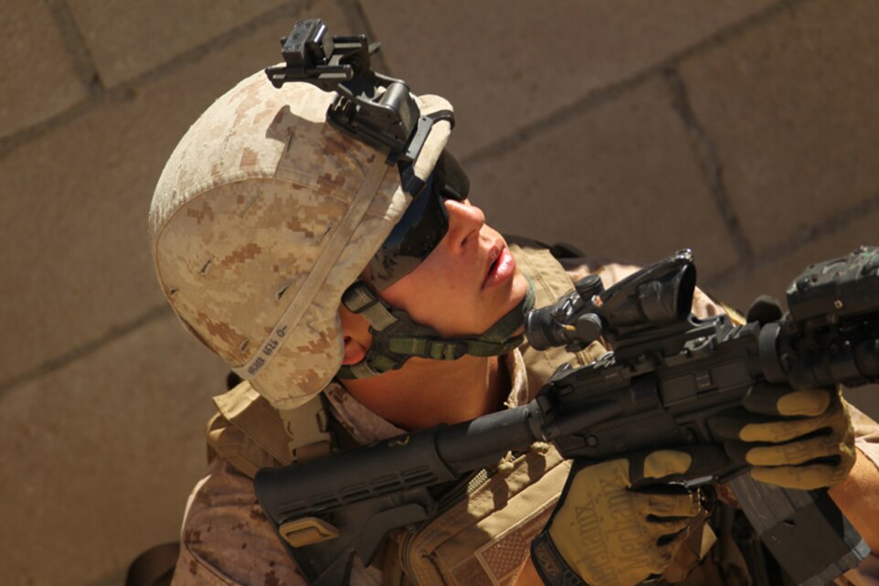 A Marine with Company B, 1st Tank Battalion moves alongside tanks manned by Australian Army soldiers at Range 200, June 25, 2013.