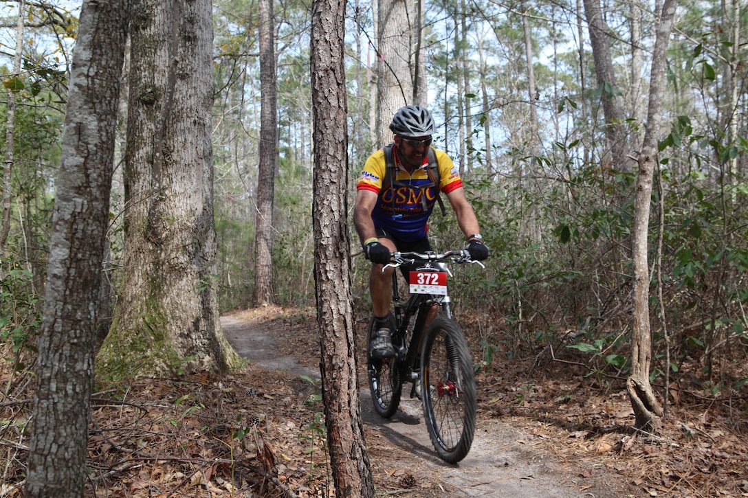 Jeff LeBlanc, the president of Down East Cyclists, a local cycling club conquers the trail and finishes the 6.5-mile race strong despite taking a spill at Henderson Pond Recreation Area aboard Marine Corps Base Camp Lejeune March 17. It was the first race his group hosted on their own trail in three years after to their old trail closed. (Photo by Pfc. Justin A. Rodriguez/released)