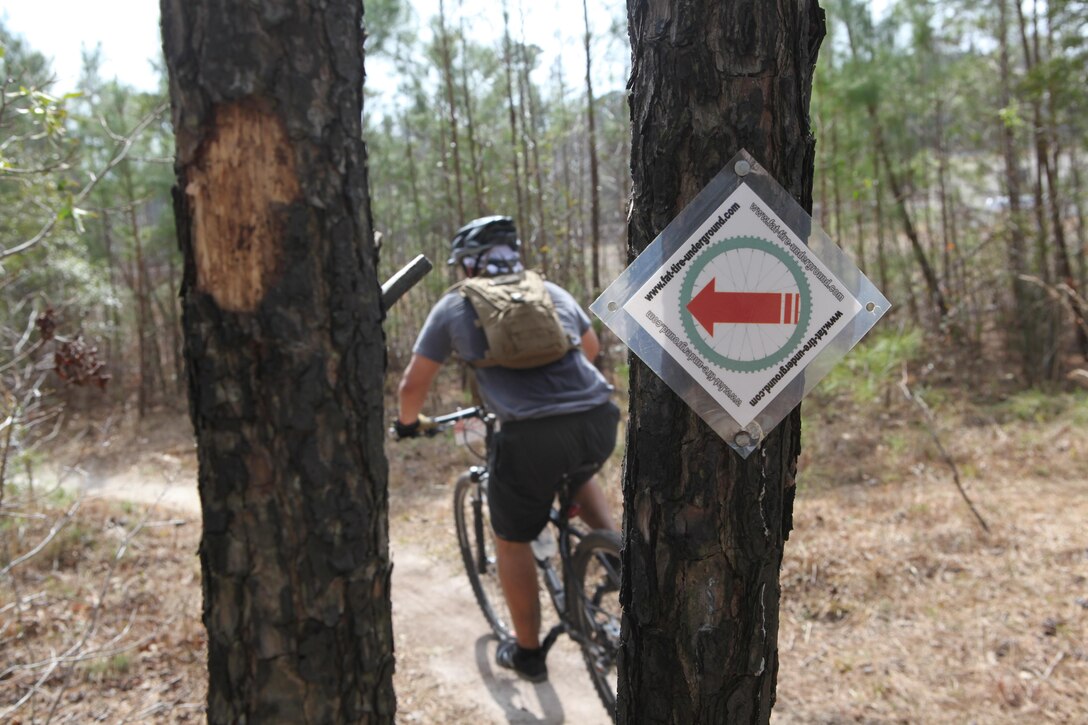 A wooded area held signs and signals telling the racers where to go during a 6.5-mile mountain-bike race hosted by Down East Cyclists, a local cycling club at Henderson Pond Recreation Area aboard Marine Corps Base Camp Lejeune March 17. (Photo by Pfc. Justin A. Rodriguez/released)