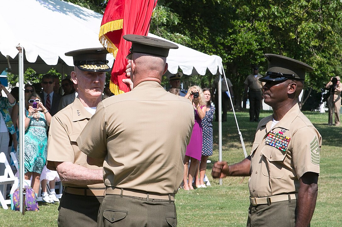 NORFOLK (June 28, 2013) - Lt. Gen. Richard T. Tryon  receives the U.S. Marine Corps Forces Command  organizational colors from Brig. Gen.  W. Blake Crowe, aboard Naval Support Activity Hampton Roads, June 28th, 2013. Lt. Gen Tryon joins MARFORCOM after his assignment as deputy commandant of Plans, Policy and Operations at Headquarters Marine Corps.