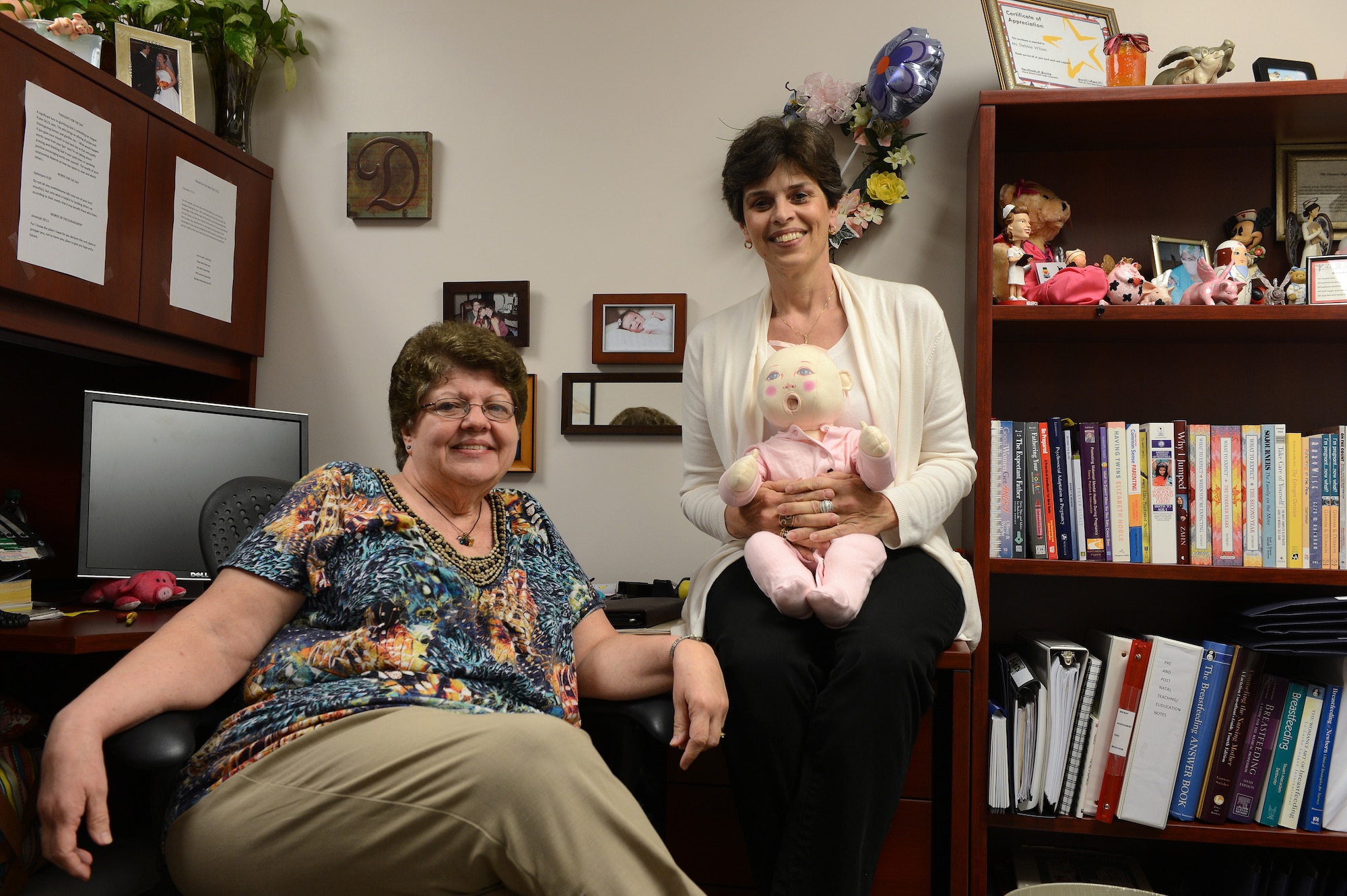 Deborah ‘Debbie’ Wilson (left), 20th Medical Group family advocacy nurse, sits with Michelle Vance, 20th MDG family advocacy nurse at Shaw Air Force Base, S.C., June 26, 2013. Both Michelle and Debbie are certified nurses who teach courses offered through the New Parent Support Program. They also make house calls to help Airmen adjust and deal with the stressors and trials of having a new child in the home. Parents with newborn children up to the age of three are eligible for these courses. For more information on these and other family oriented programs, call family advocacy at (803) 895-6091. (U.S. Air Force photo by Airman 1st Class Daniel Blackwell)