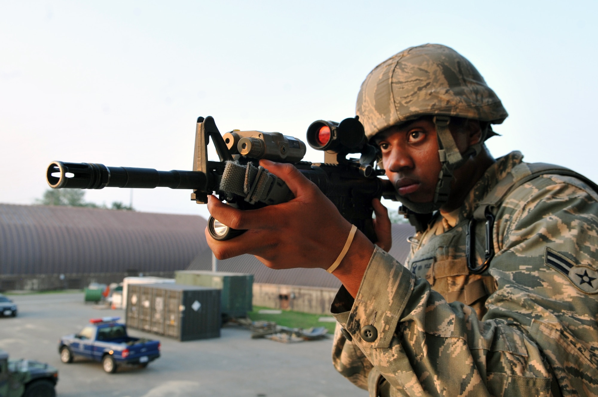 Airman 1st Class Benjamin Poles, 51st Security Forces Squadron Quick Reaction Team member, posts perimeter security during a simulated hostage situation in a joint QRT training exercise at Osan Air Base, Republic of Korea, June 29, 2013. Perimeter security is paramount to ensure no outside threat or unnecessary interference impedes the response. (U.S. Air Force photo/Senior Airman Alexis Siekert)