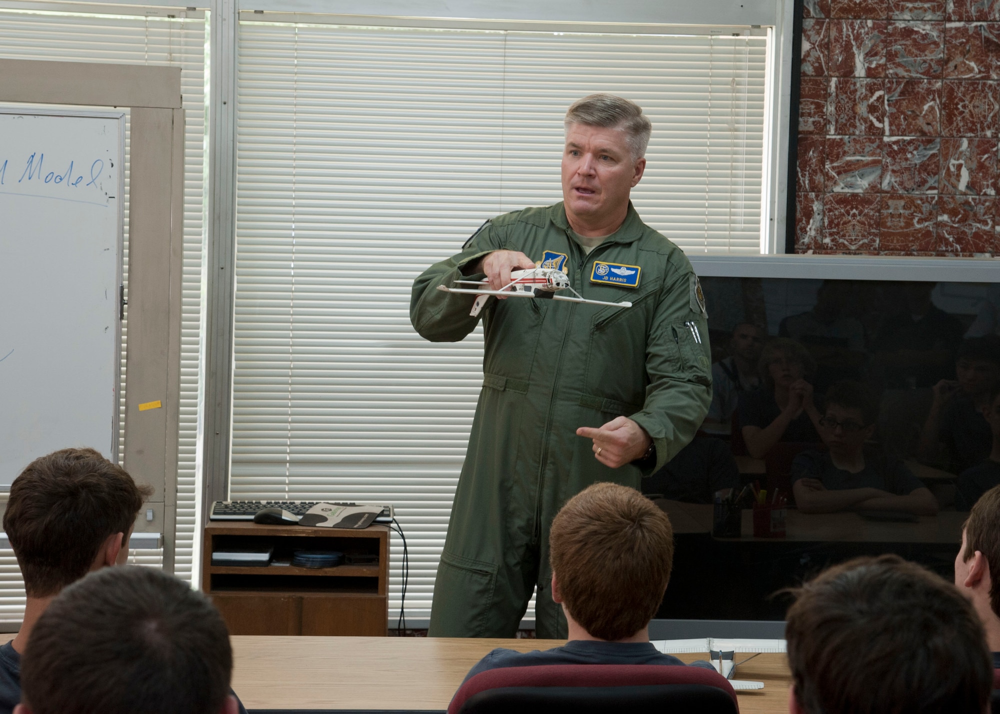 YOKOTA AIR BASE, Japan – Brig. Gen. Jerry Harris, the vice commander of the 5th Air Force and a fellow Eagle Scout himself, tells Boy Scouts his experiences as an F-16 pilot during a commander's briefing at Yokota Air Base, Japan, June 18, 2013. Harris used the model aircraft to visually explain his story.  (U.S. Air Force photo by Airman 1st Class Soo C. Kim)