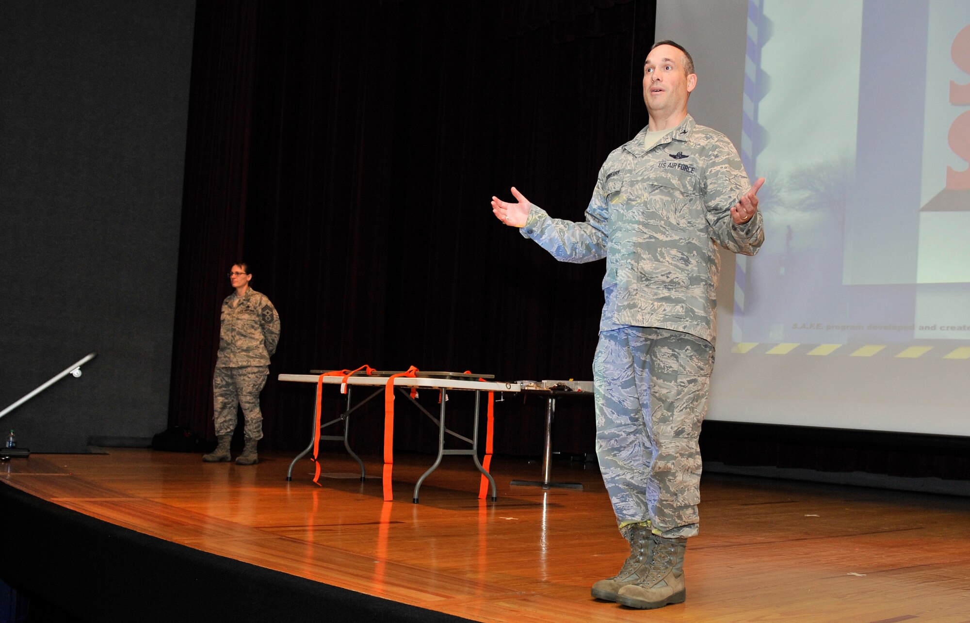 Col. Brian Newberry, 92nd Air Refueling Wing commander, speaks to members of Team Fairchild before the 'Street Smart' presentation by Stay Alive From Education at Fairchild Air Force Base, Wash., June 20, 2013. The presentation was founded in 1988 to educate teens and young military members about the consequences of driving under the influence, illegal drug use and not using a seat belt. (U.S. Air Force photo by Staff Sgt. Michael Means/Released)