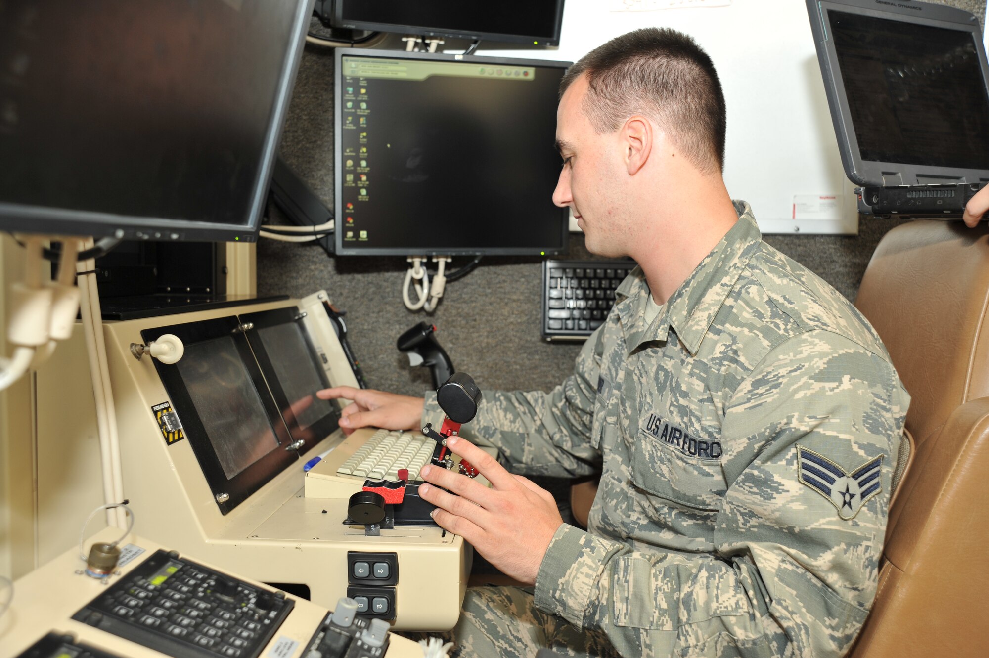 LAS VEGAS, Nev. -- A communication specialist from the 432nd Aircraft Communication Maintenance Squadron runs a system check on a ground control station before a mission June 27, 2013, in support of the 432nd Wing Hunt, a remotely piloted aircraft competition, which took place from June 23-28. This year marks the second RPA competition in southern Nevada where nearly a dozen squadrons competed against one another to determine the best team to execute the mission effectively. (U.S. Air Force photo by Tech. Sgt. S.E./Released)