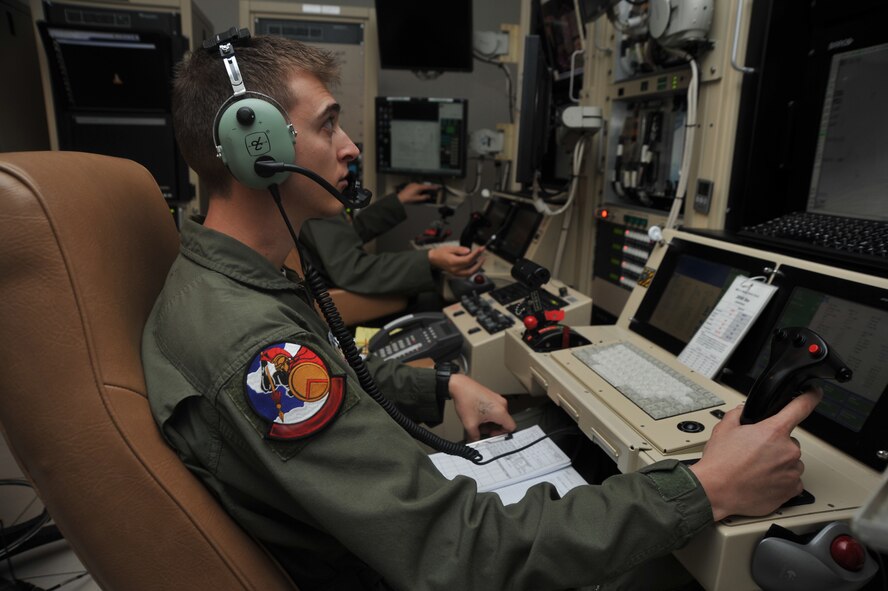 LAS VEGAS, Nev. -- An MQ-1 Predator aircrew member searches for a training target on the Nevada Test and Training Range June 27, 2013, during the 432nd Wing Hunt, a remotely piloted aircraft competition, which took place June 23-28. This is the second year for the competition, which helps the RPA community build camaraderie through realistic tactical environments with teams from active duty, Reserve and Air National Guard RPA squadrons. [Photo edited for security reasons] (U.S. Air Force photo by Tech. Sgt. S.E./Released)