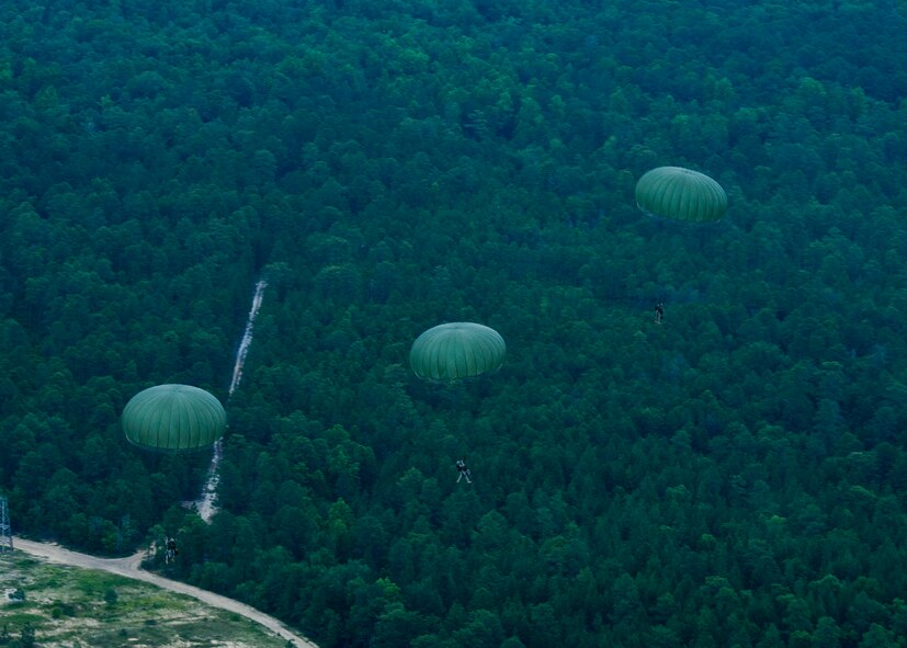 U.S. Army Soldiers from the 82nd Airborne Division, descend toward a drop zone during Joint Operational Access Exercise above Fort Bragg, N.C., June 22, 2013. A total of 2,426 paratroopers jumped out of C-130Js assigned to Dyess Air Force base, Texas, during the 12-day exercise. JOAX is a combined military training exercise designed to prepare Airmen and Soldiers to respond to worldwide crises and contingencies. (U.S. Air Force photo by Airman 1st Class Damon Kasberg/Released)