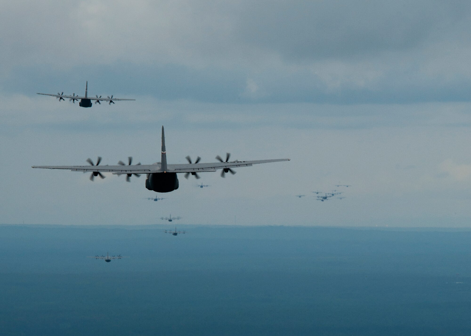 A formation of U.S. Air Force C-130Js fly towards a drop zone during Joint Operational Access Exercise above North Carolina, June 22, 2013.  JOAX is a combined military training exercise designed to prepare Airmen and Soldiers to respond to worldwide crises and contingencies. While supporting the exercise, Dyess set the world record for the largest C-130J formation ever flown with 20 aircraft in a single formation. (U.S. Air Force photo by Airman 1st Class Damon Kasberg/Released)