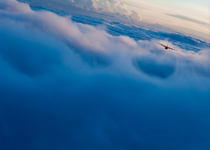 A U.S. Air Force C-130J flies towards a drop zone during Joint Operational Access Exercise above North Carolina, June 24, 2013. Dyess, Air Force Base, Texas, supported JOAX with 20 C-130Js and 87 aircrew members, which delivered more than 2,400 paratroopers and more than 140 tons of equipment to multiple drop zones. (U.S. Air Force photo by Airman 1st Class Damon Kasberg/Released)