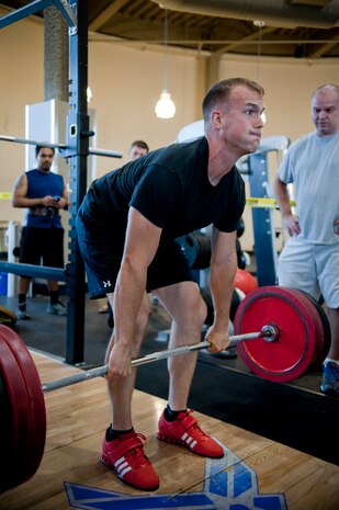 Senior Airman Justin Peschman, 57th Aircraft Maintenance Squadron crew chief, dead lifts 500 pounds during a weight lifting competition at the Nellis Warrior Fitness Center June 28, 2013. Participants did bench presses, squats and dead lifts to tally a winning score. (U.S. Air Force photo by Caitlin Kenney)