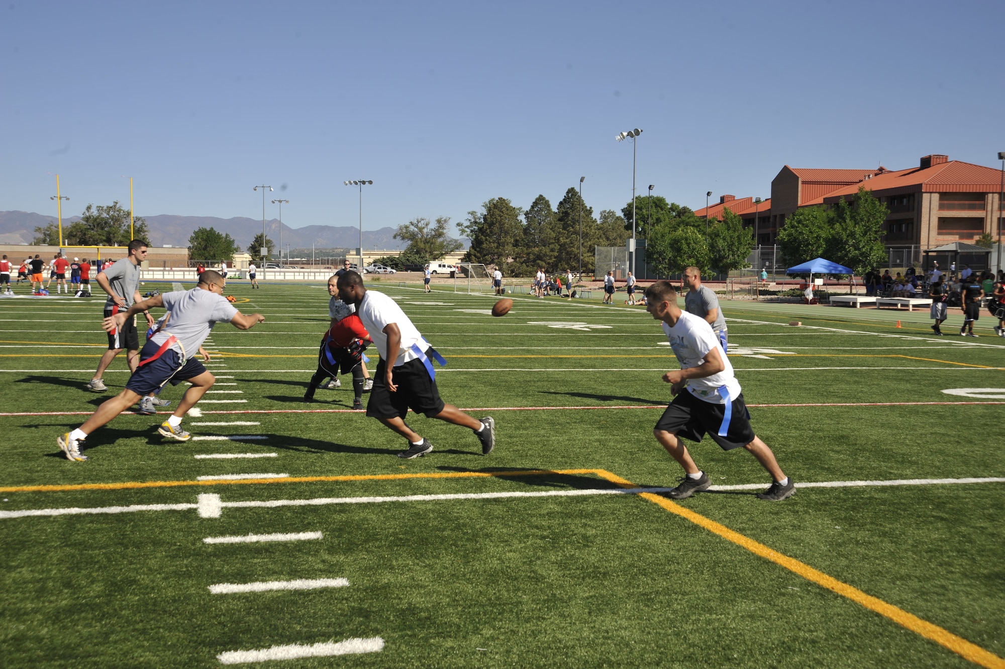 PETERSON AIR FORCE BASE, Colo. – Football was another offering June 27 at the 21st Space Wing's annual sports and field day. The annual event challenges Airmen and civilians to test their skills and stamina while building camaraderie, and of course allow bragging rights. (U.S. Air Force photo/Dennis Howk)