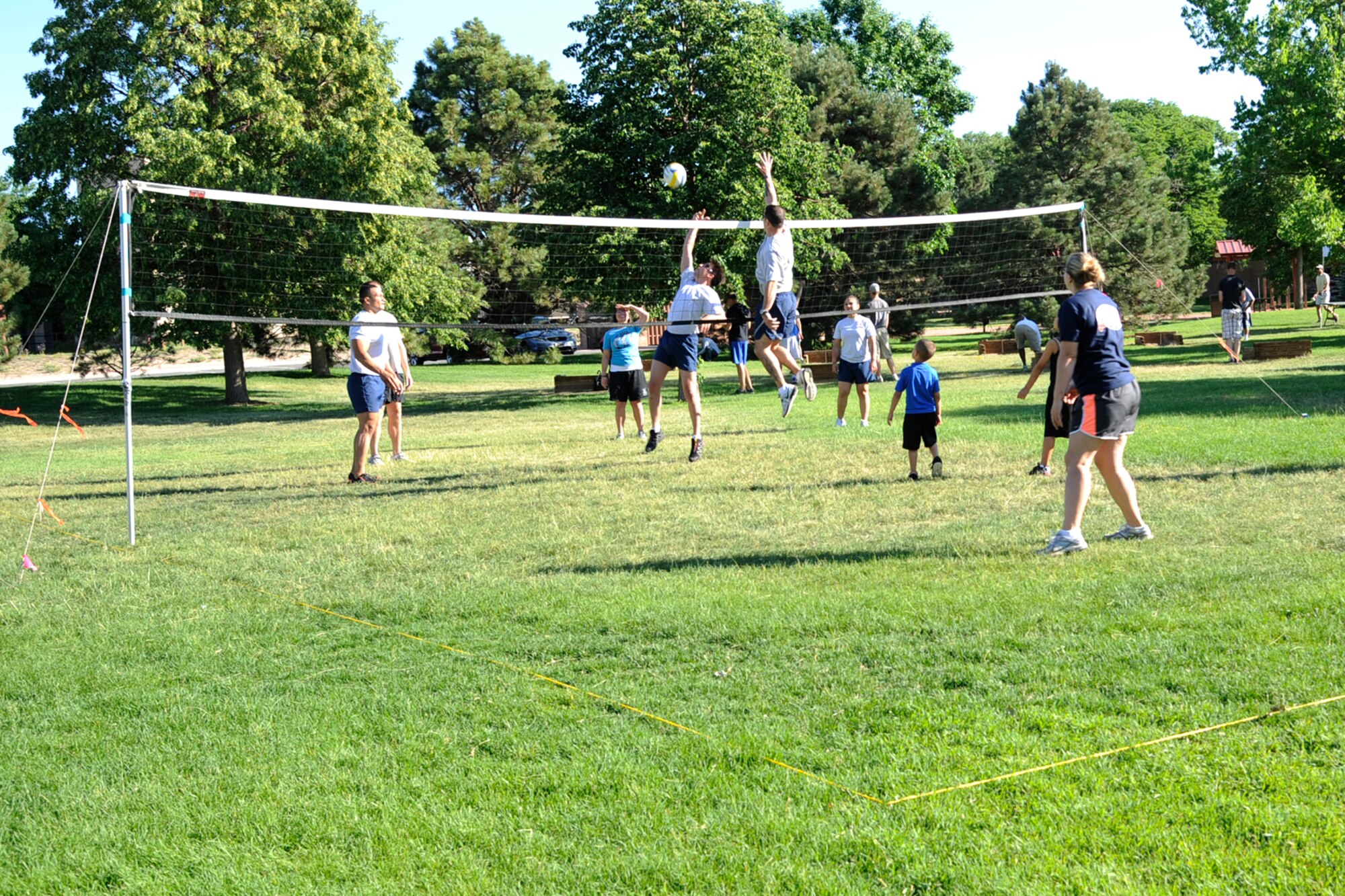 PETERSON AIR FORCE BASE, Colo. – Volleyball players get in an early practice prior to the sports and field day volleyball tournament June 27. The annual sports and field day challenges Airmen and civilians to test their skills and stamina while building camaraderie, and of course allow bragging rights. (U.S. Air Force photo/Rob Bussard)