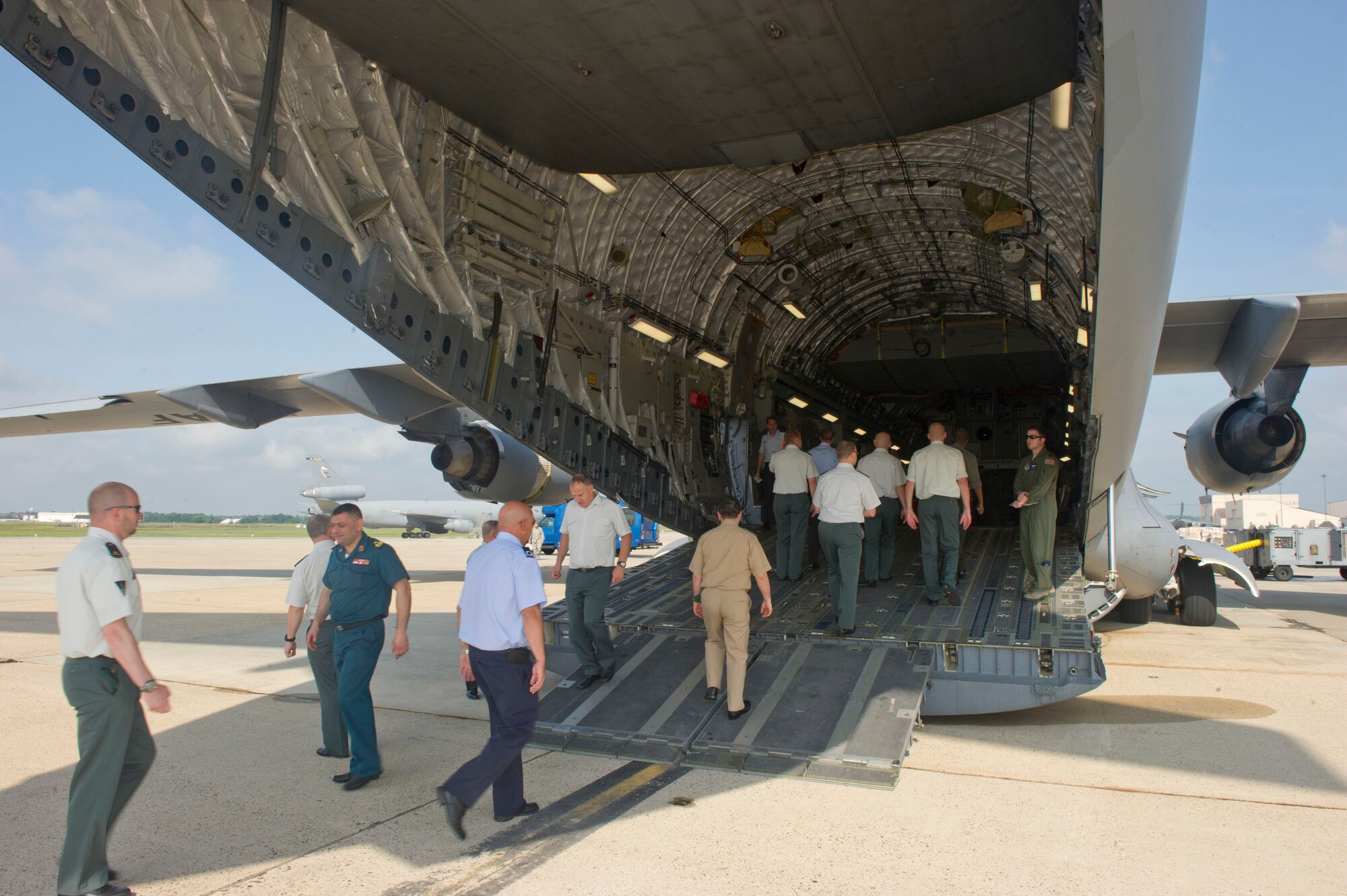 JOINT BASE MCGUIRE-DIX-LAKEHURST, N.J. -- Students from the Advanced Staff Course at the Royal Military Academy, walk into a C-17 Globmaster III static display during a tour of the 621st Contingency Response Wing, here, June 27, 2013. The tour is part of the yearlong leadership course given in Brussels, Belgium and gives students a chance to gain valuable cross-cultural military experience. (U.S. Air Force photo by Staff Sgt. Gustavo Gonzalez)
