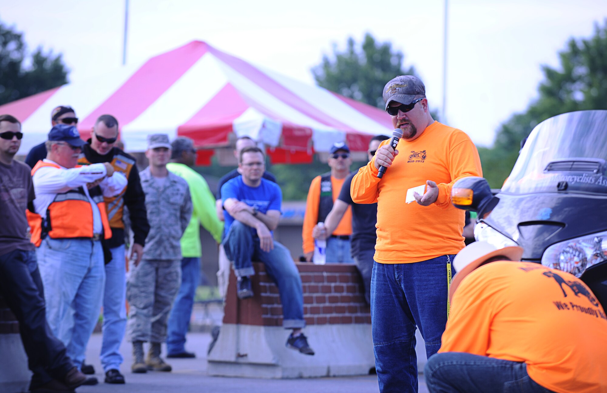 An instructor at the 3rd annual Joint Base Andrews Motorcycle Safety Day instructs riders on how to conduct a proper pre-ride motorcycle inspection June 28, 2013. The event focused on reducing accidents among riders by providing educational demonstrations and activities. (U.S. Air Force photo/Jim McKinney)