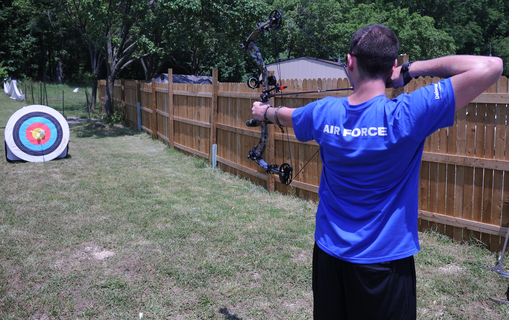 Airman 1st Class Clint Williams shoots archery at the Archery range here at Joint Base Andrews as part of the Wounded Warriors Adaptive Sports Camp on June 26. This activity is helps build upper body strength. (U.S. Air Force Photo by Airman 1st Class Joshua R. M. Dewberry)
