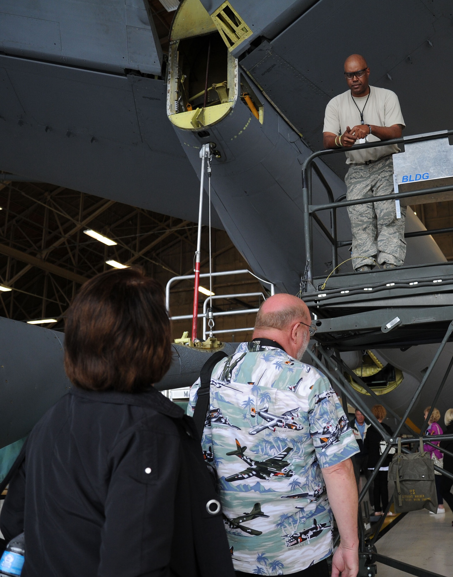 Tech. Sgt. Aaron Jones, 141st Maintenance Squadron crew chief, answers questions during a base tour at Fairchild Air Force Base, Wash., June 25, 2013. The honorary commanders received a base tour, which included stops at the headquarters building, periodic inspection dock, non-destructive inspection, aircraft metals technology, hydraulics section and a KC-135 Stratotanker static display. (U.S. Air Force photo by Airman 1st Class Janelle Patiño/Releaed)